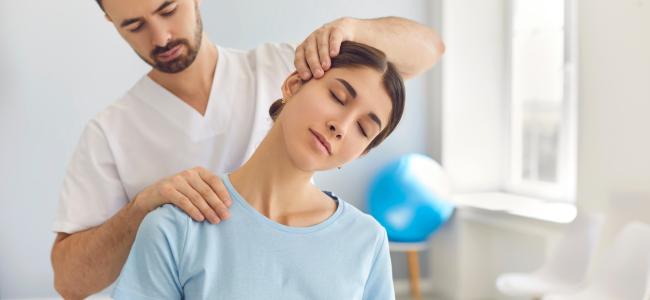 woman recieving neck treatment from professional