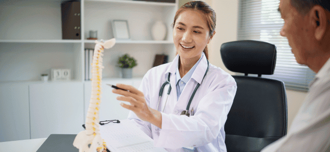 doctor explaining the spine to a patient
