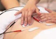 placing electrodes on persons back